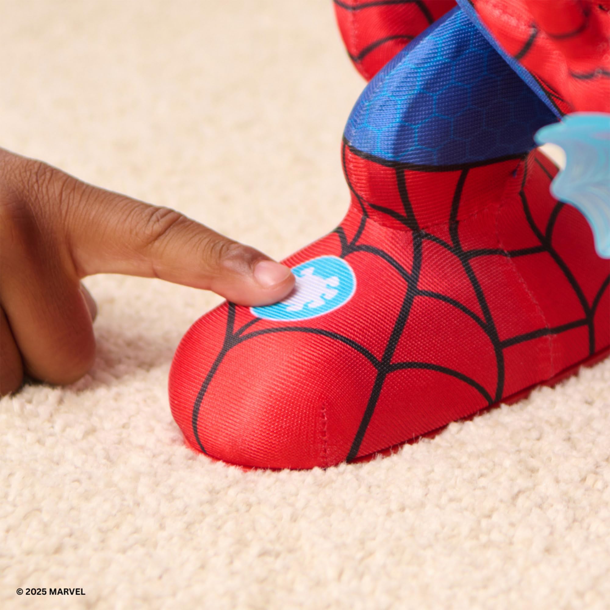 Spider-Man themed shoe with a hand pressing a blue button on a beige carpet
